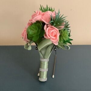 Artificial succulents and pink champagne roses wedding bouquet